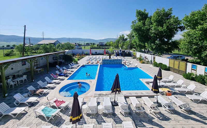 Enjoy sunny days at Laguna Bazaleti's open swimming pool. 0