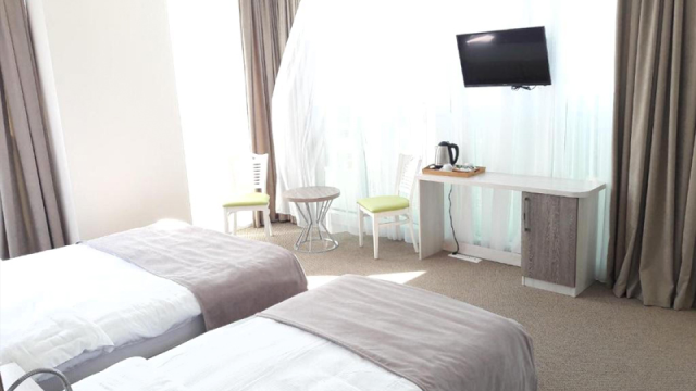 Take advantage of the discount on a two-guest stay at the Green Glass Hotel. image 3