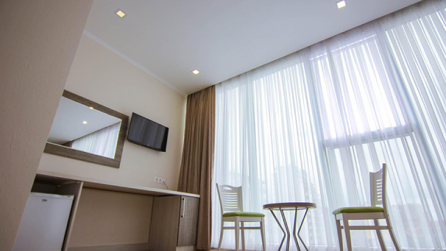 Take advantage of the discount on a two-guest stay at the Green Glass Hotel. image 2