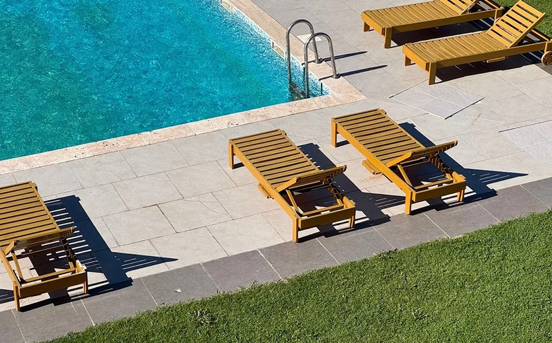 Spend your sunny days at the outdoor swimming pool in the Kingdom. 0
