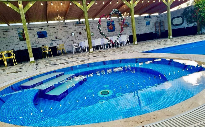 Enjoy sunny days at Laguna Bazaleti's open swimming pool. 7