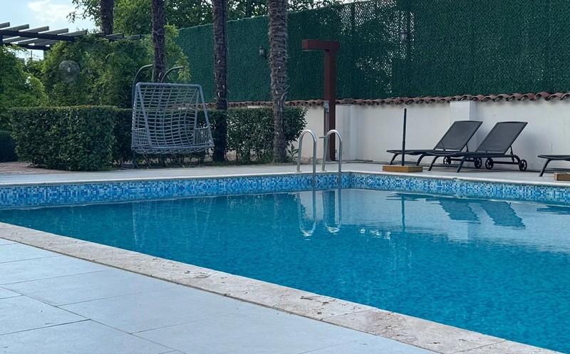Spend your sunny days at the outdoor swimming pool in the Kingdom. 1
