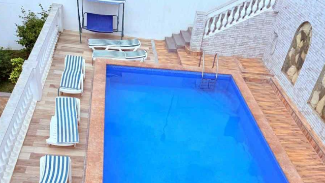 Take advantage of a discount on a one-time visit to the outdoor swimming pool at Hilltop Skyline. image 6