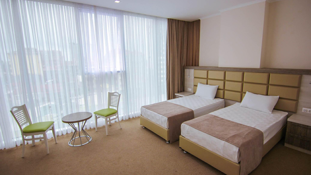 Take advantage of the discount on a two-guest stay at the Green Glass Hotel. image 1